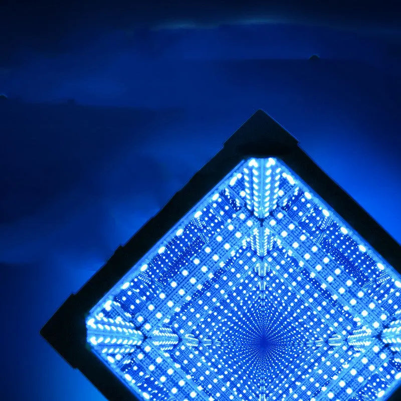 Thousand Mirrors 3D magic cube RGB LED lamp in black with remote control on desk