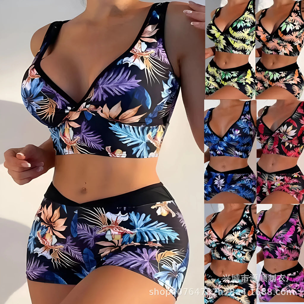 Women's two-piece printed swimsuit with sleeveless top and briefs-style bottoms in a multi-colour design.