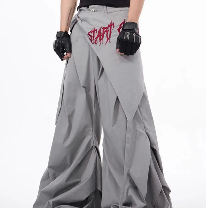 Boy modelling black Korean-style wide-leg summer trousers in a casual setting.