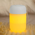 Small white cylindrical USB-powered personal humidifier on a desk.