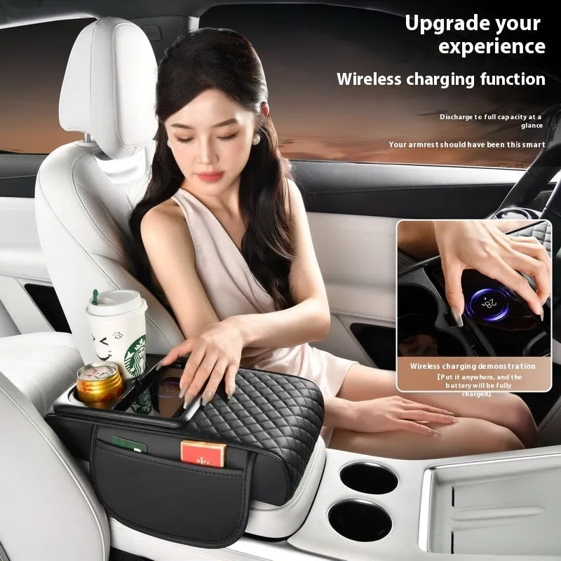 Leather car armrest box cover with wireless charging pad, tissue storage, and cup holder in black.