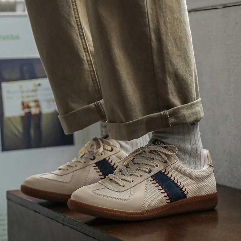 White mesh men's fashion casual exercise sneakers with flat heel on display