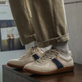 White mesh men's fashion casual exercise sneakers with flat heel on display