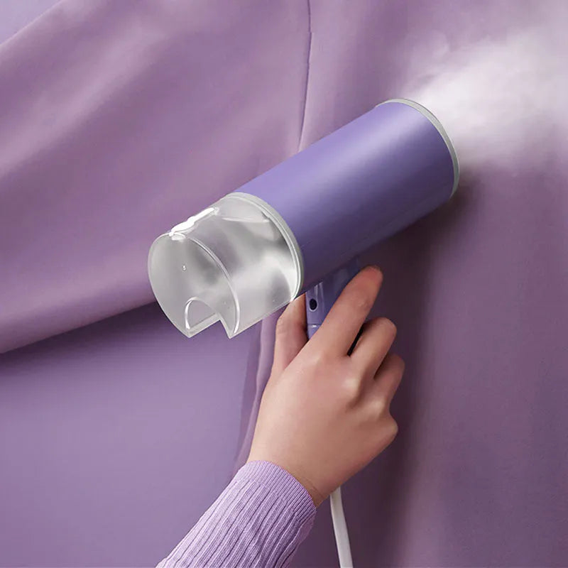 Portable handheld garment steamer in grey lotus root purple colour with foldable design and water reservoir