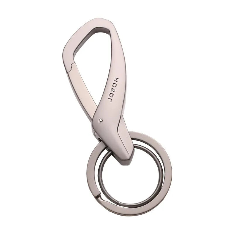 Black zinc alloy rectangular key chain with a carabiner clip and double ring, shown next to a set of keys for scale.