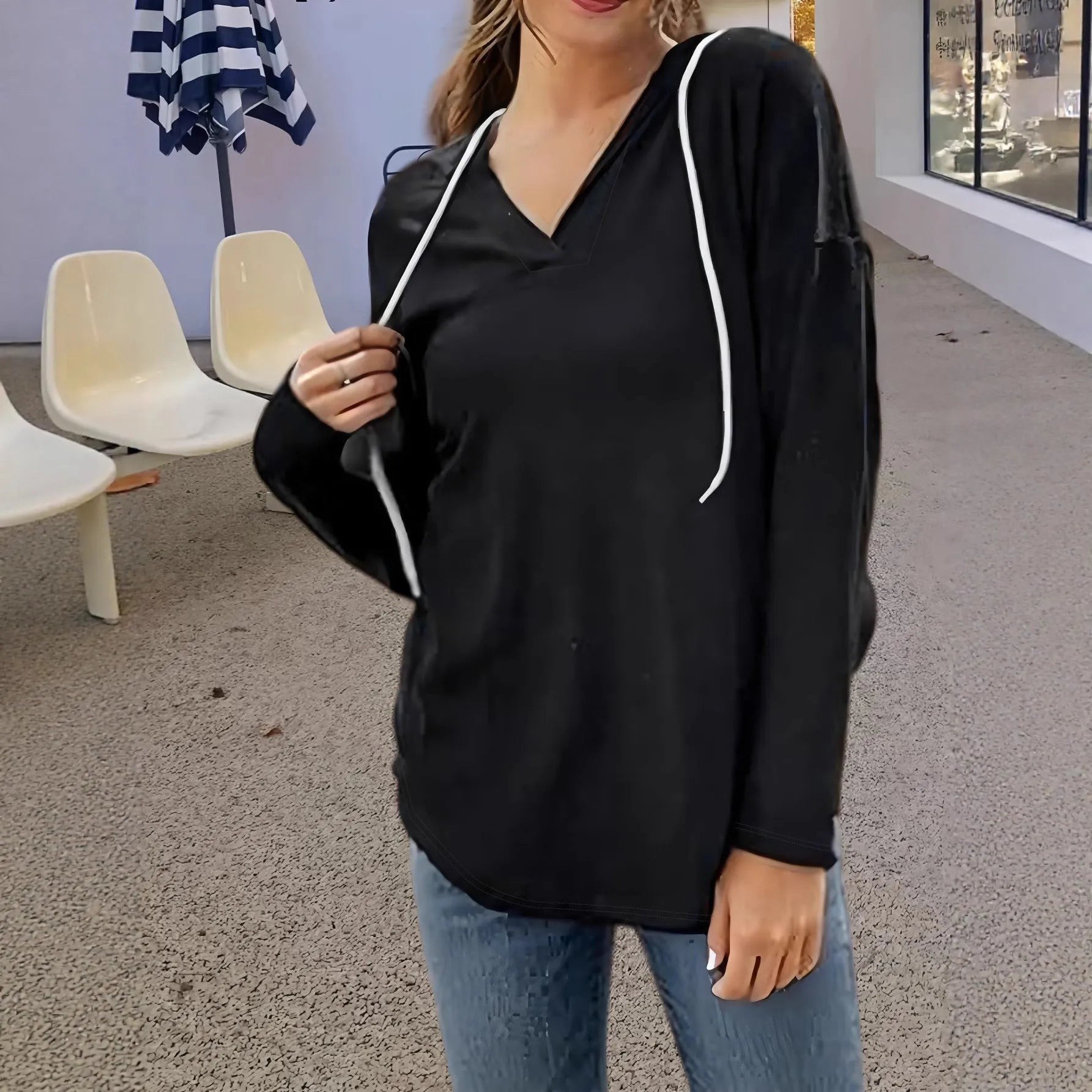 Women's red V-neck hooded sweatshirt with long sleeves and loose fit design