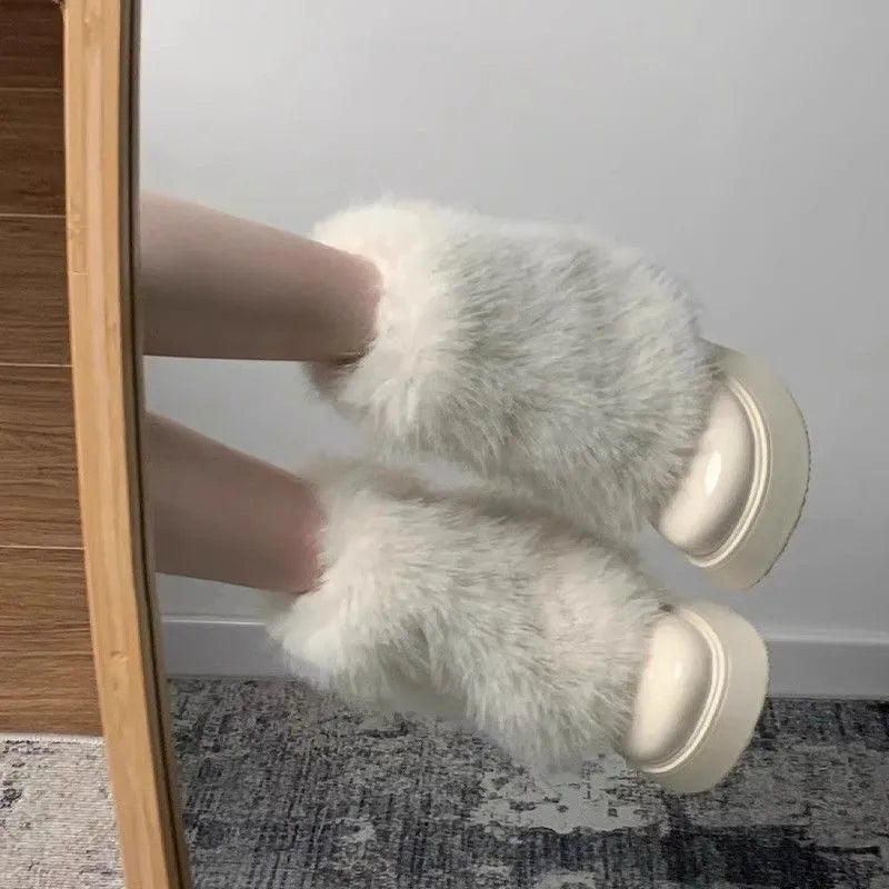 Women's black low-top snow boots with plush fleece lining and a waterproof rubber platform sole