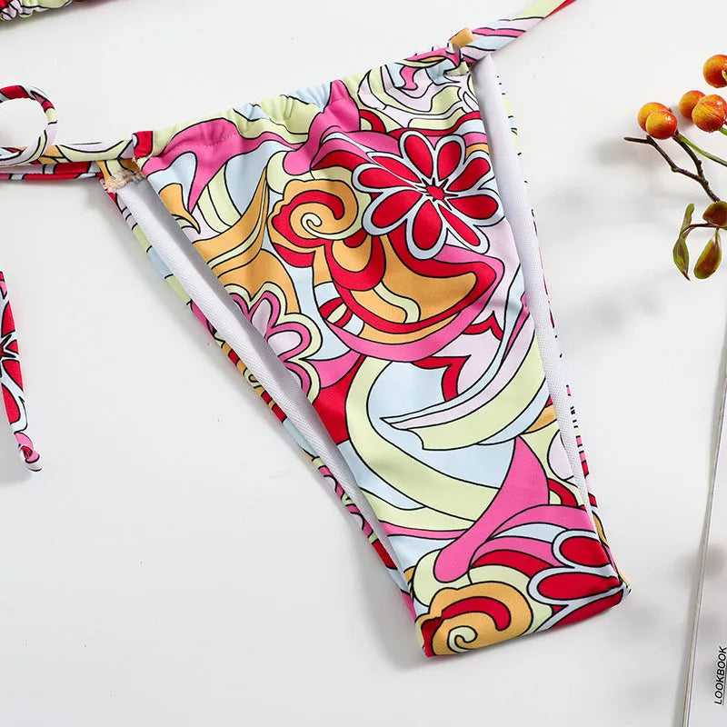 Women's triangle print bikini set with halter neck top and separate bottoms in multicolour pattern