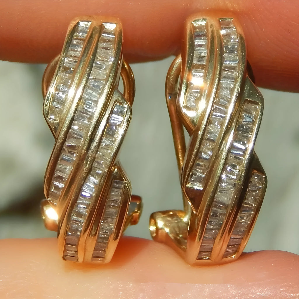 A pair of gold-coloured geometric earrings made from copper with round design elements.