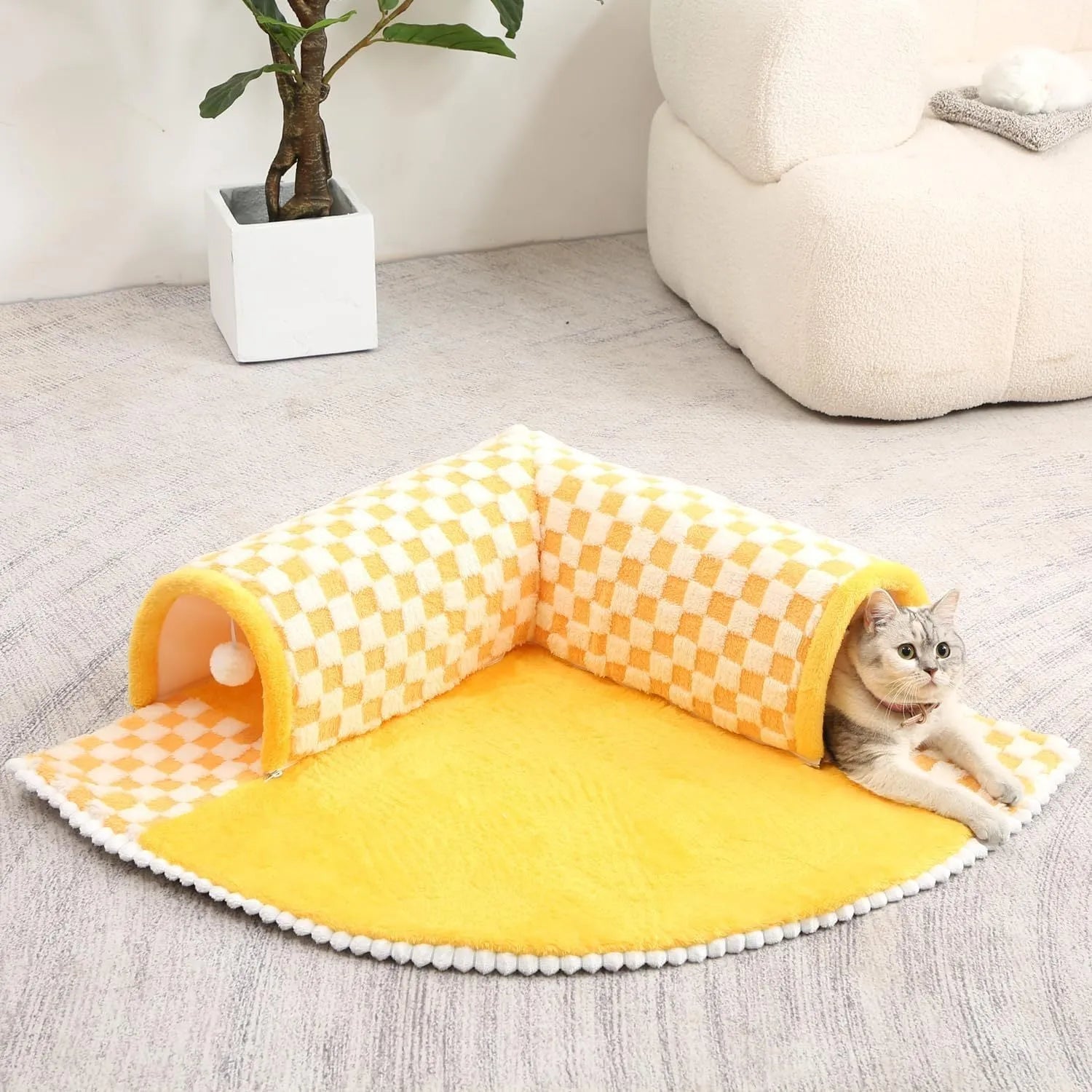 Fan-shaped plush pet bed for dogs and cats with a central tunnel, shown in a yellow colour.