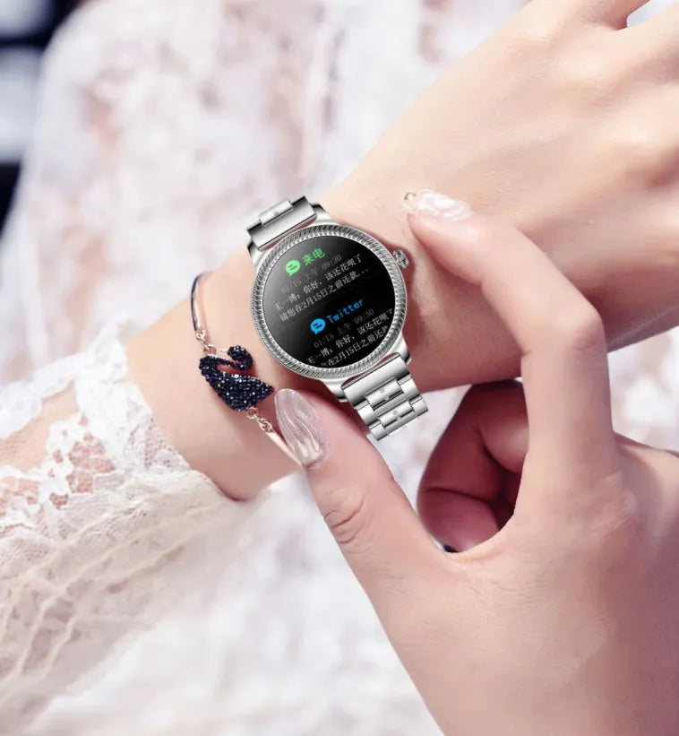 AK38 ladies smart watch with stainless steel Milanese bracelet and 1.09-inch colour screen displayed.