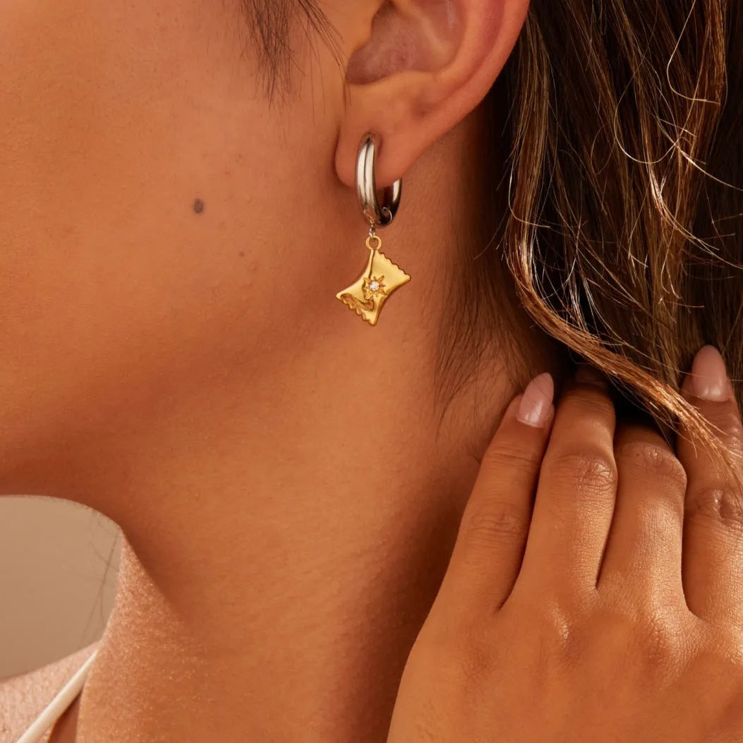 Women's stainless steel Christmas tree and heart earrings with electroplated finish showing geometric shapes