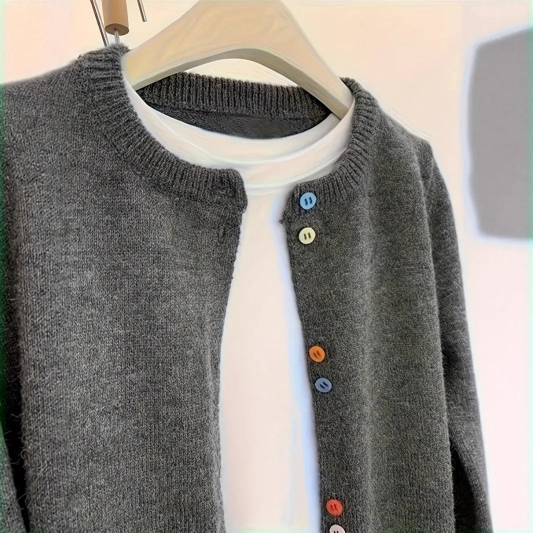 Women's dark grey button-front polyester cardigan sweater on a hanger.