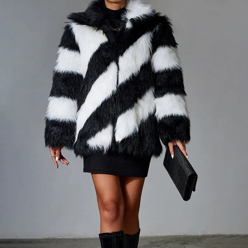 Black and white contrast lapel faux fur coat with a fur collar, shown on a model.