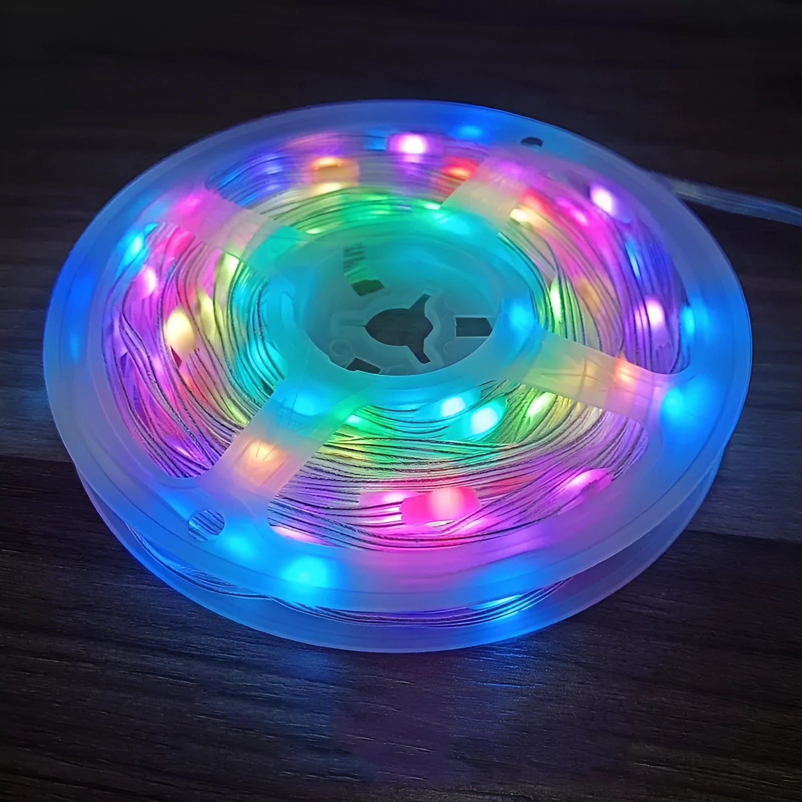Long 10-metre multi-colour LED party light string with 100 lights coiled on a reel.