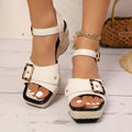 White women's chunky heel sandals with a square toe and large metal buckle fastening on the strap.