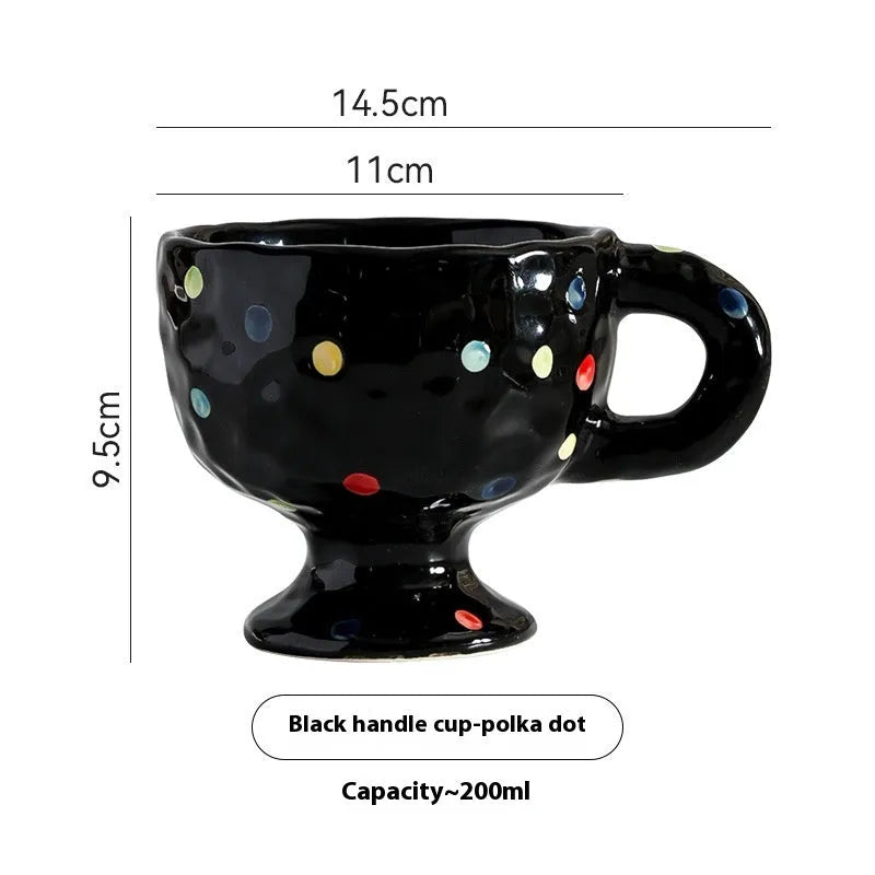 Hand-pinched irregular shaped ceramic mug in a solid colour on a plain background.