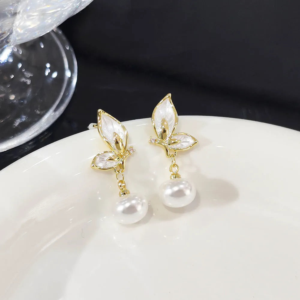 Copper butterfly earrings with electroplated finish and zircon painting detailing