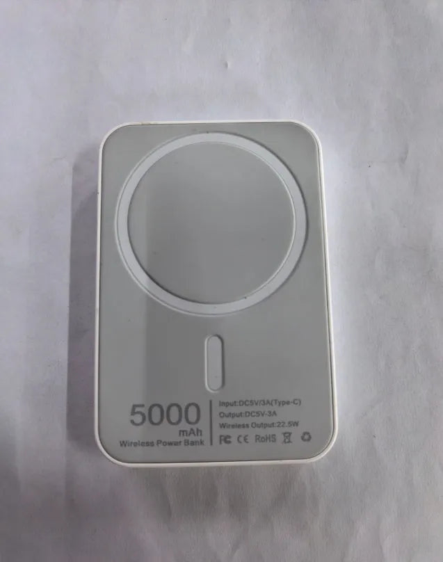 White wireless power bank with magnetic charging surface showing 5000mAh capacity label