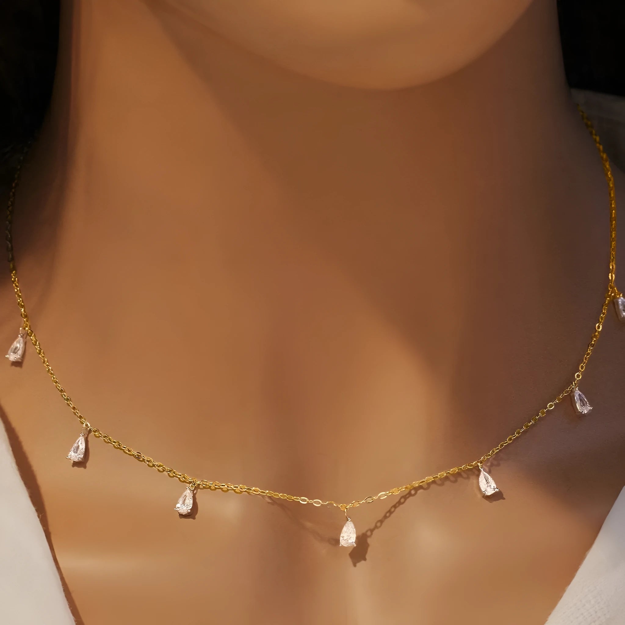 Drop-shaped artificial zircon necklace on an adjustable O-chain in silver, rose gold, or golden yellow finish.