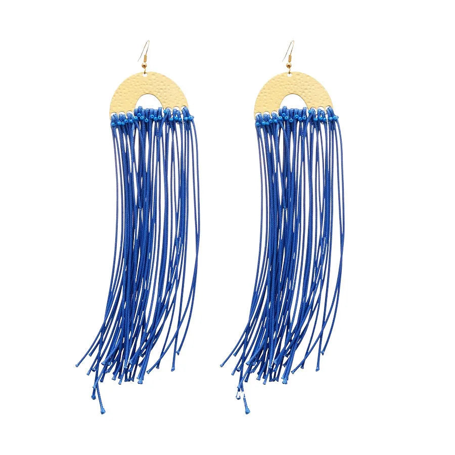 Geometric women's earrings made from blue and silver cloth with round design elements.