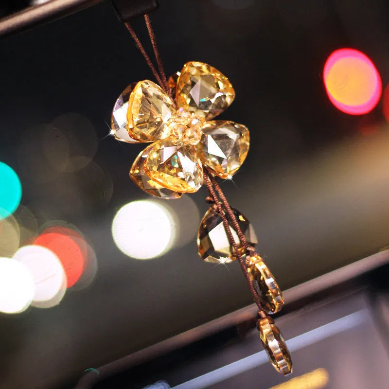 Crystal Four Leaf Grass car interior hanging pendant approximately 20cm long on a clear background.