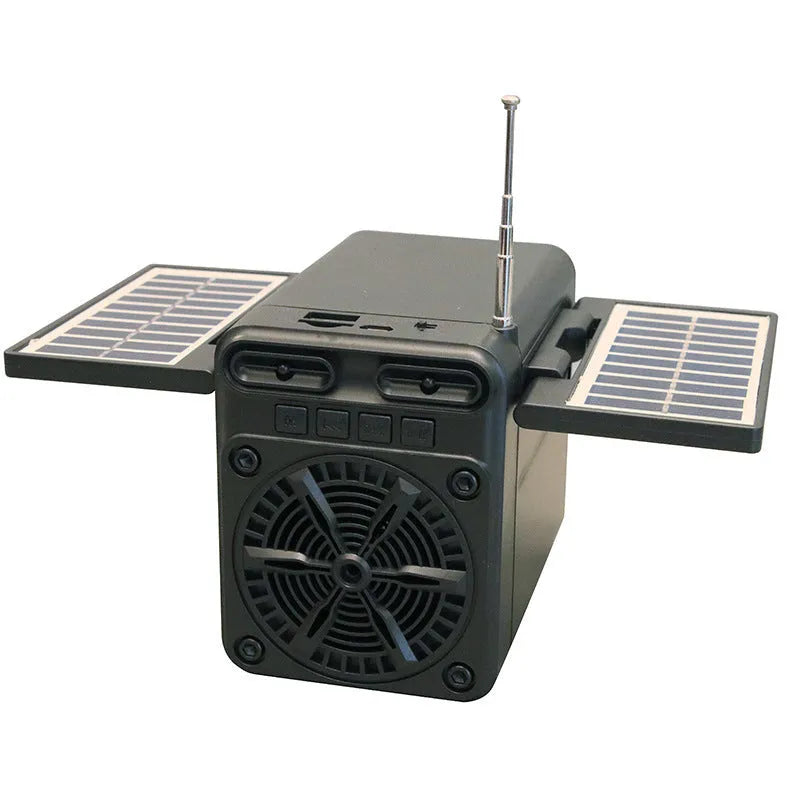 Black plastic solar emergency FM radio with USB charging port and built-in speaker, 10.5x11.5x9.5 cm