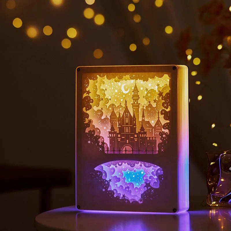 Modern white USB night light with a three-dimensional carved pattern and remote control on a wooden bedside table.