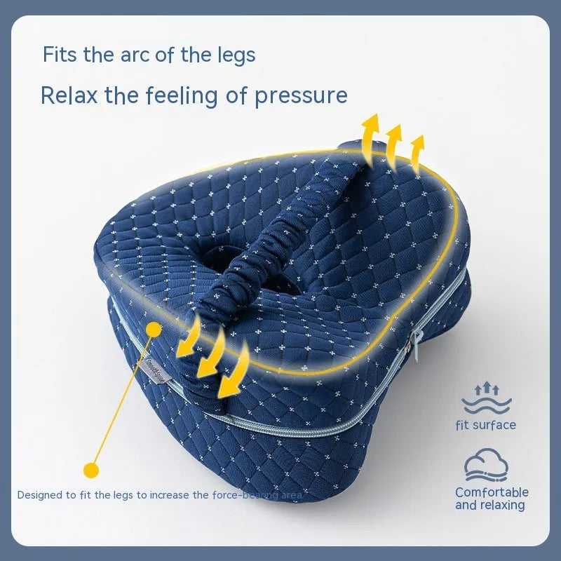 A dark blue jacquard love heart-shaped memory foam leg pillow for adults.