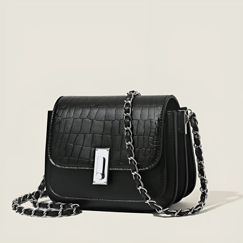 Women's black soft PU chain shoulder bag with square shape and cross-body strap.
