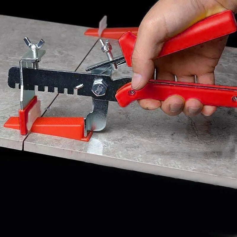 Red PVC and stainless steel tile leveling clip measuring 23 by 11.5 cm for floor tile installation