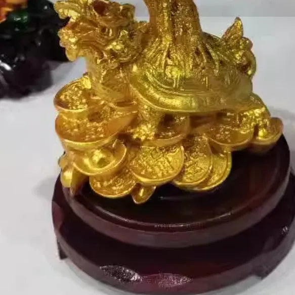 Citrine resin turtle money tree Feng Shui ornament on a white background.