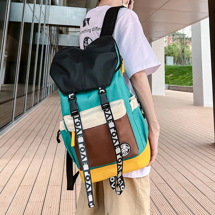 A mid-size black Oxford cloth backpack shown with handheld and two-shoulder carry options.