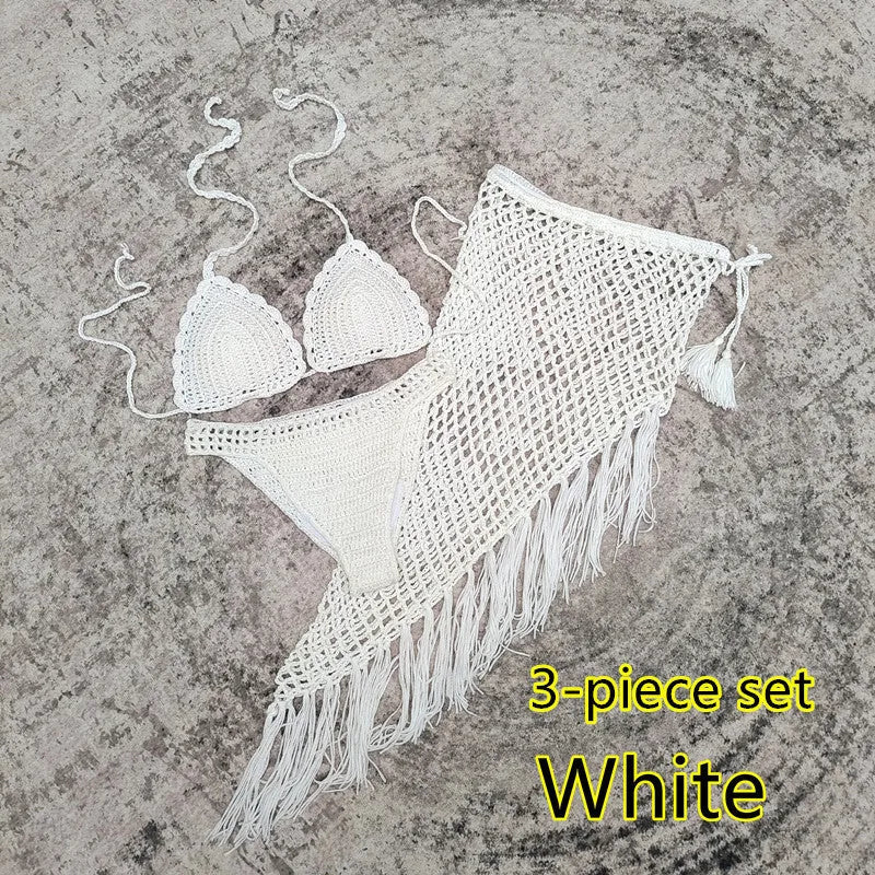 Women's white handmade crochet bikini swimsuit set with a separate matching skirt.