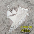 Women's white handmade crochet bikini swimsuit set with a separate matching skirt.