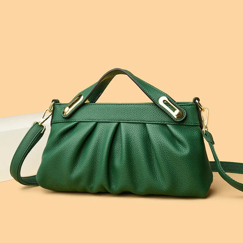 Genuine leather crossbody bag with pleated shoulder strap and wrinkled composite leather finish in horizontal square shape
