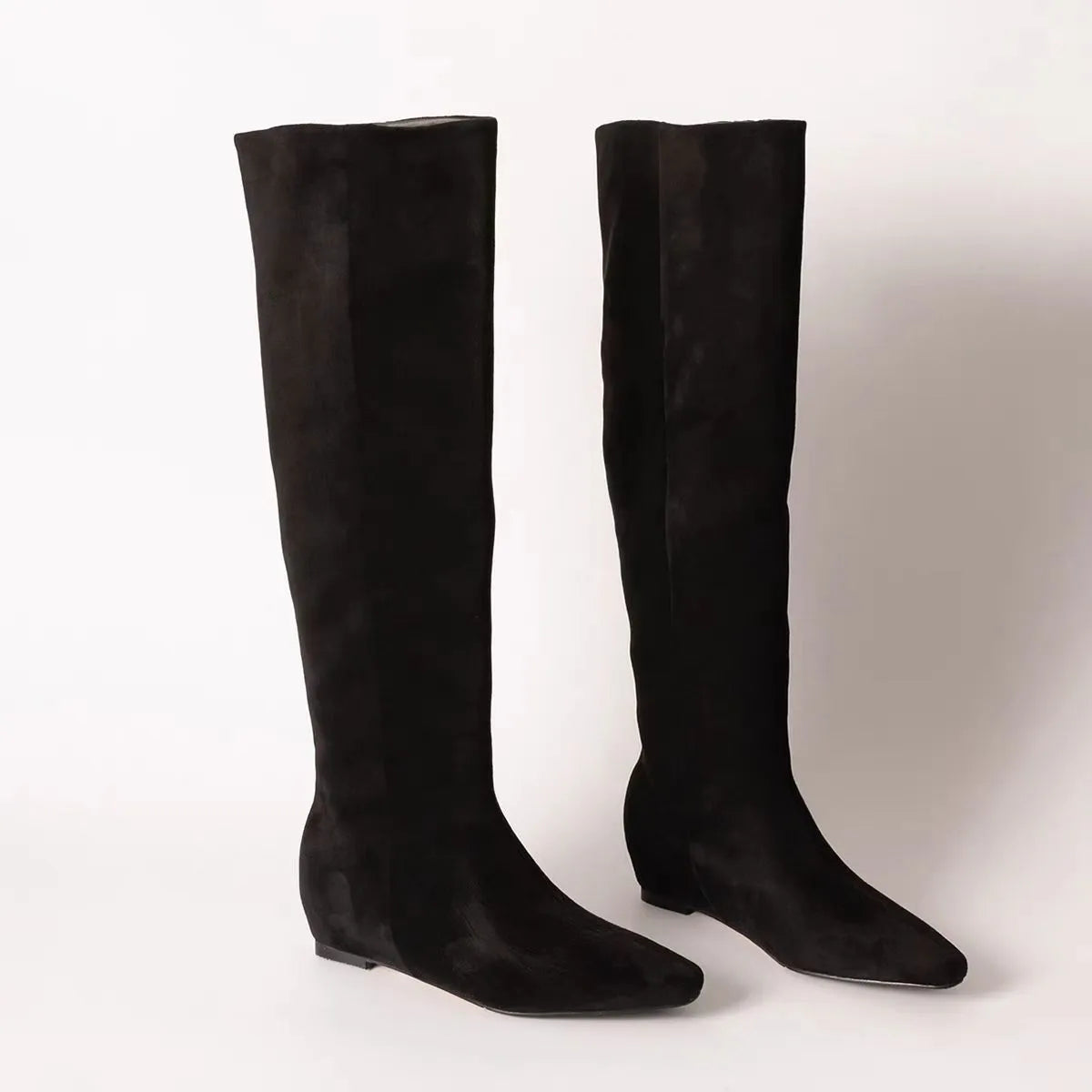 Retro style square toe tall knight boots in black with mid heel and cowhide upper