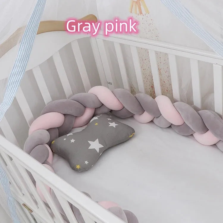 Long, flexible baby crib bumper pillow in spandex velvet, shown fitted around a white cot for safety protection.