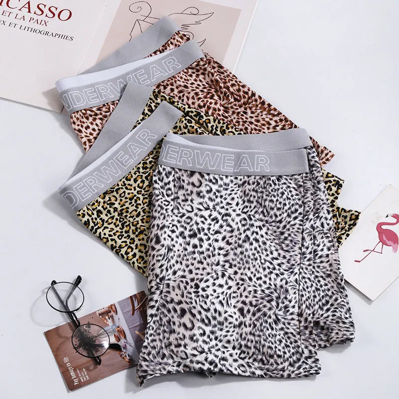 Men's loose fit leopard print boxer shorts in polyester milk silk fabric showing mid-waist design