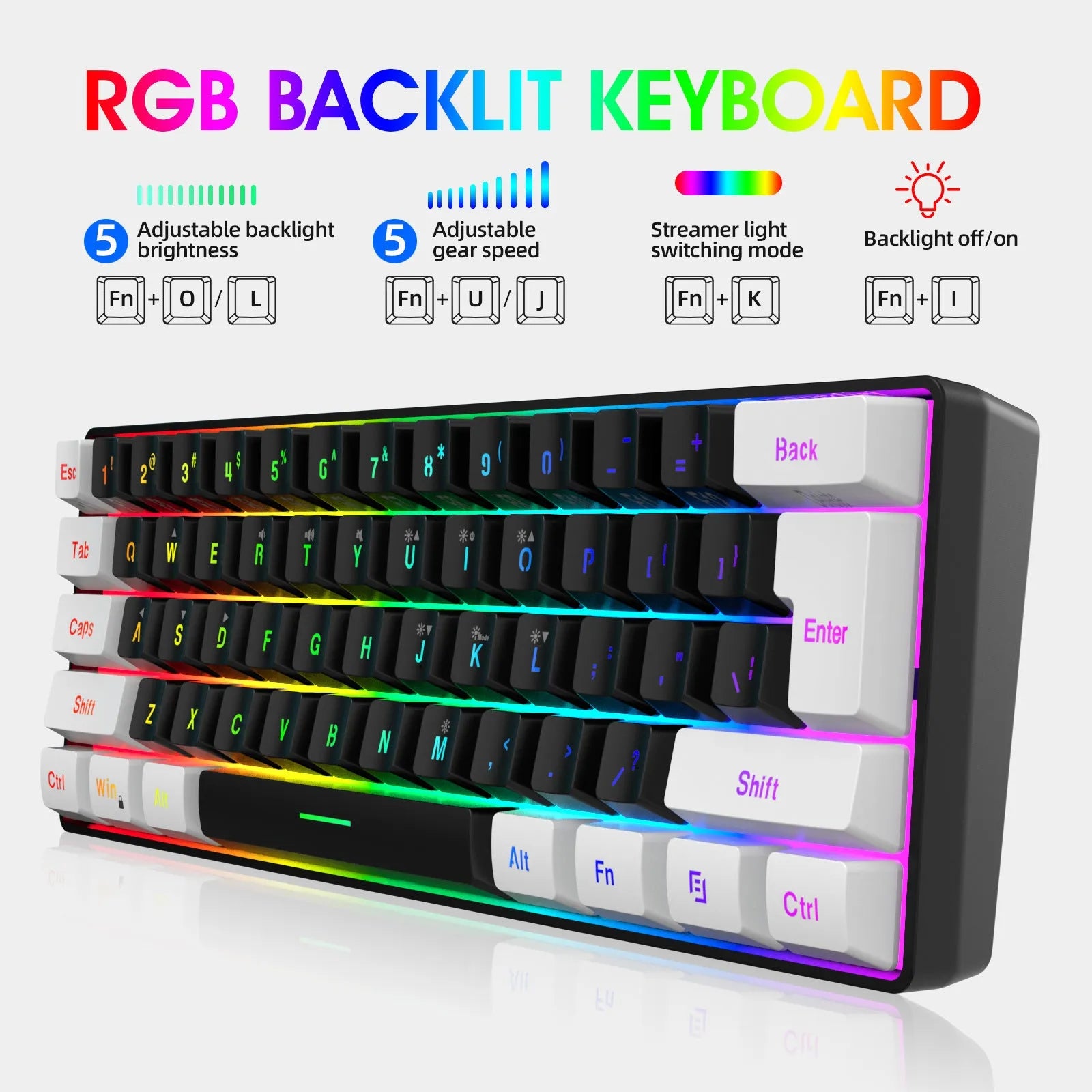 White and black wired 61-key USB membrane keyboard on a desk next to a laptop.