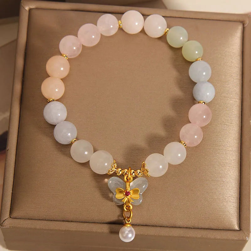 Women's crystal bracelet with butterfly pendant featuring natural morganite stones in candy colours