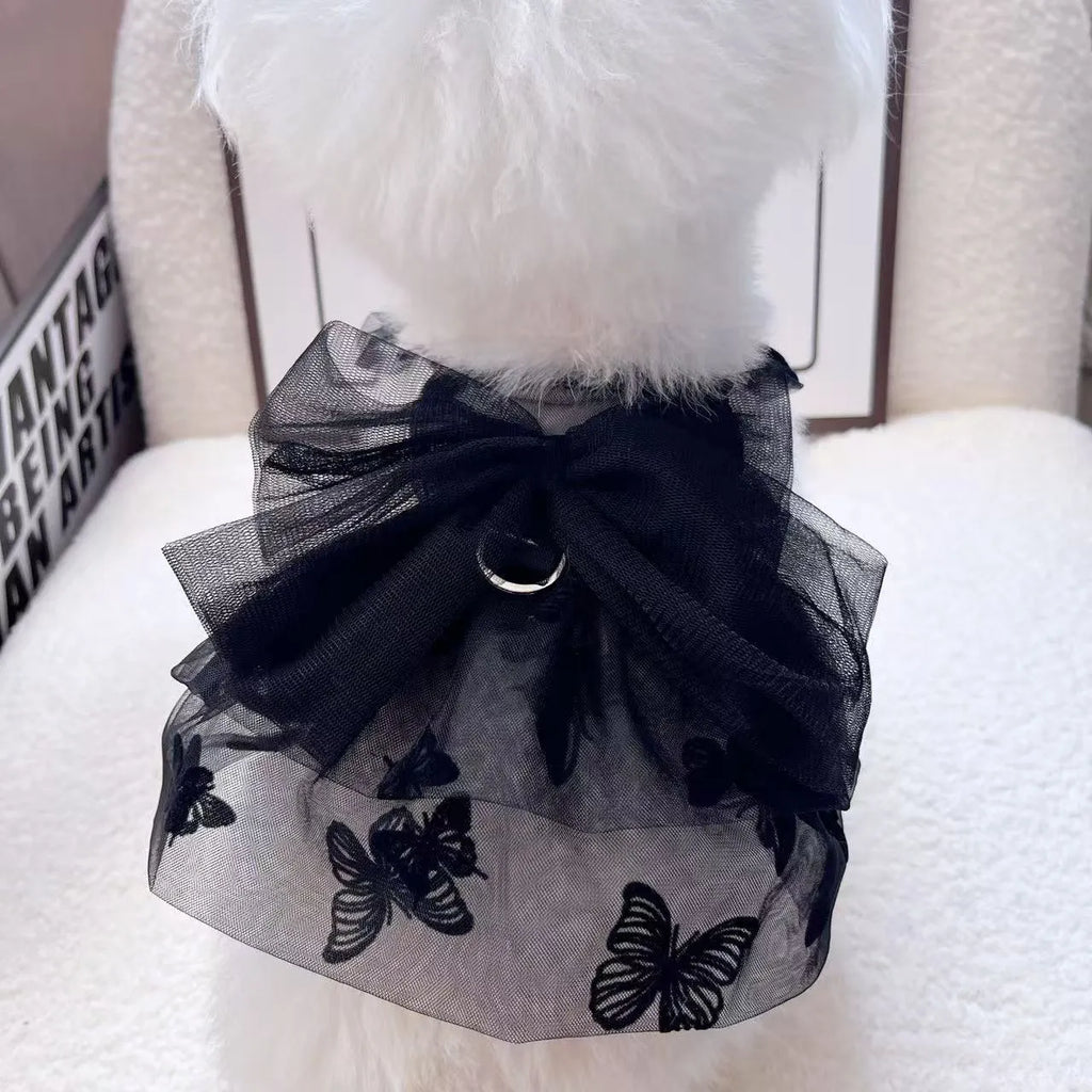 Black tiered tulle princess skirt on a small dog, showing the gauze layers and fit.