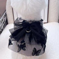 Black tiered tulle princess skirt on a small dog, showing the gauze layers and fit.