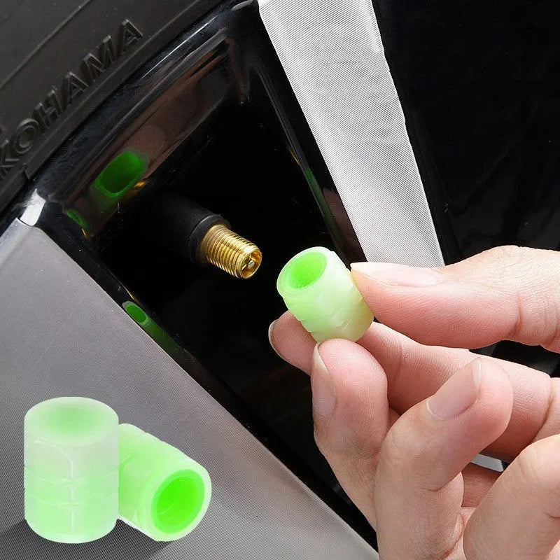 Glow-in-the-dark rubber car valve caps in 16x12mm size showing luminous property