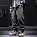 Men's grey casual sweatpants with elastic ankle ties in straight cut style for sport and leisure