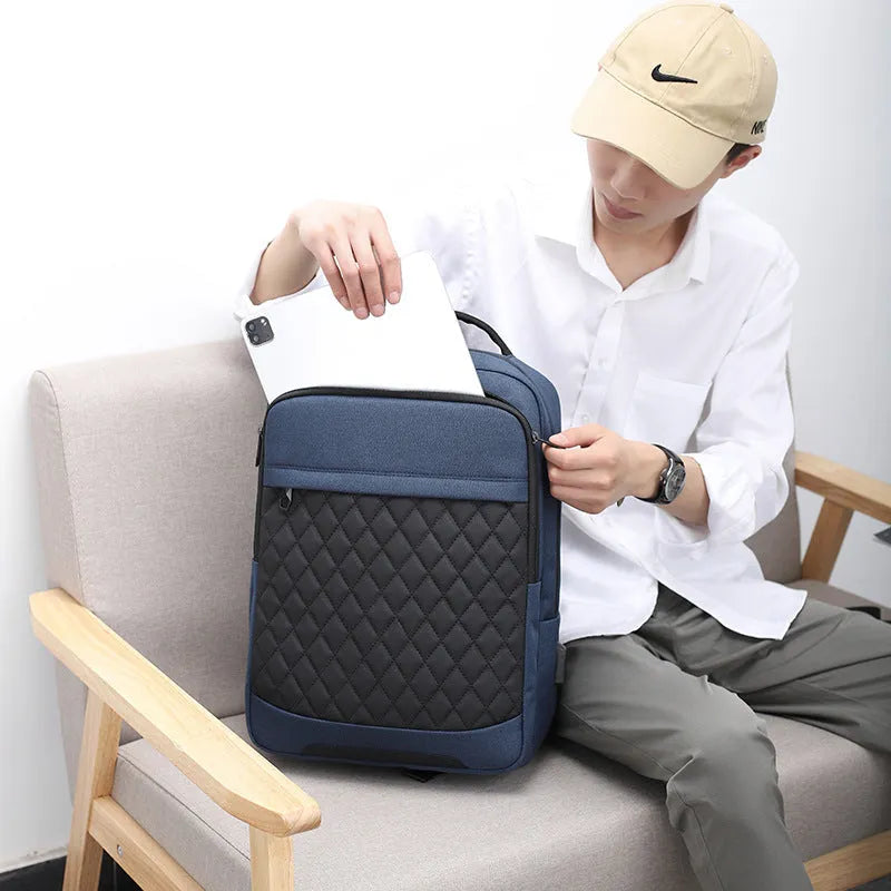 Men's Oxford cloth travel backpack in black with curved shoulder strap and diamond mesh detail