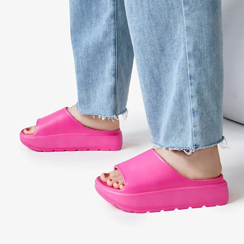 Women's thick-soled beach slippers in beige with a textured EVA sole.