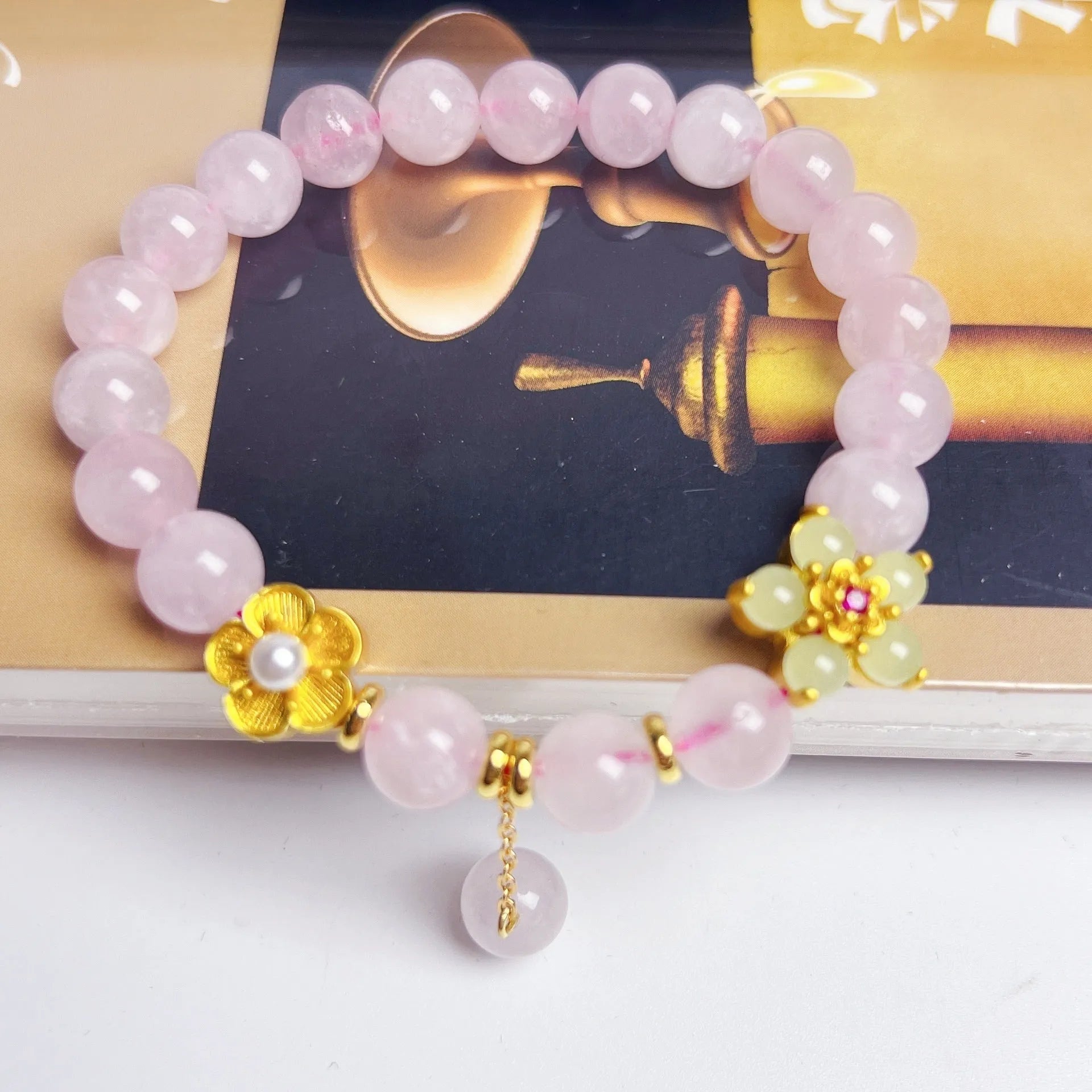 Pink Chinese crystal peach blossom bracelet with adjustable design on wrist