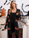 Women's black cardigan with orange knitted pumpkin head jacquard pattern.
