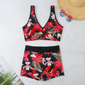 Women's two-piece printed swimsuit with sleeveless top and briefs-style bottoms in a multi-colour design.